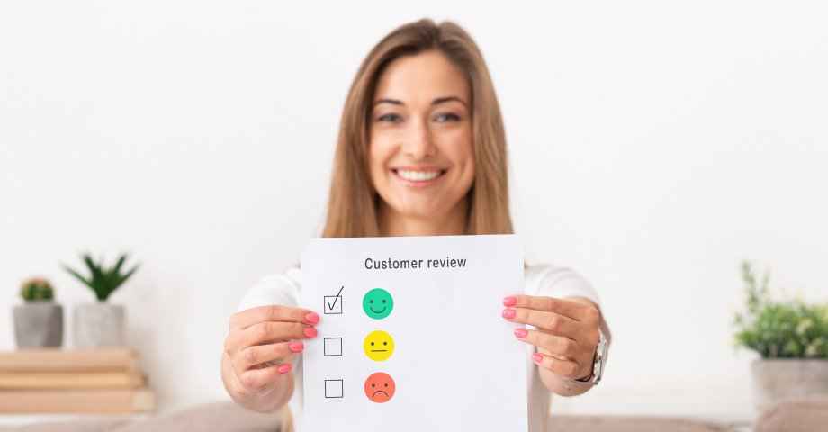 best content for youtube channels - Image of woman holding a sheet with the words 'customer review' written on it 