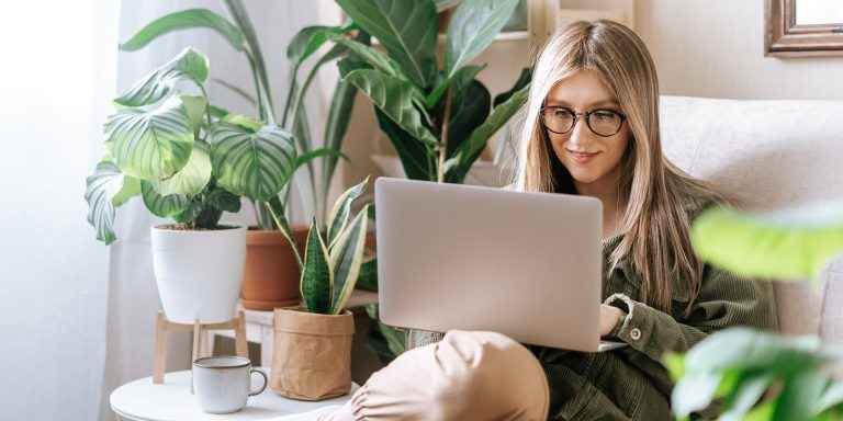 start freelancing - Image of a woman typing on her laptop 